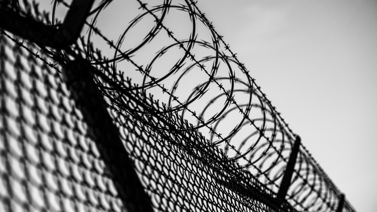 Barbed wire on top of a prison fence 