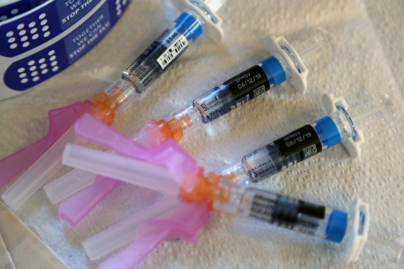 Four vaccine syringes