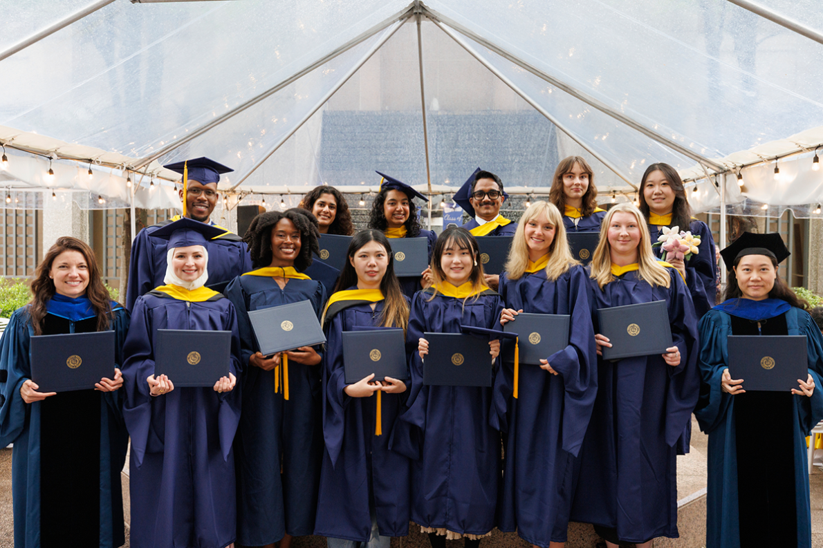 Group photo of graduates in caps and gowns