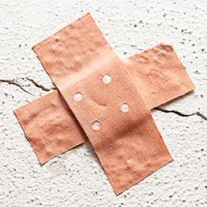 Two crossed band-aids