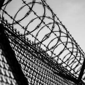 Barbed wire on top of a prison fence 