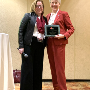 Lesley Curtis, right, receives the QCOR Outstanding Lifetime Achievement Award at AHA 23