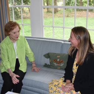 Fomer first lady Rosalynn Carter speaks with a colleague.